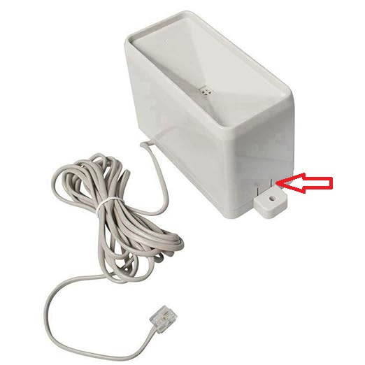 Tabs to press to remove the rain gauge cover